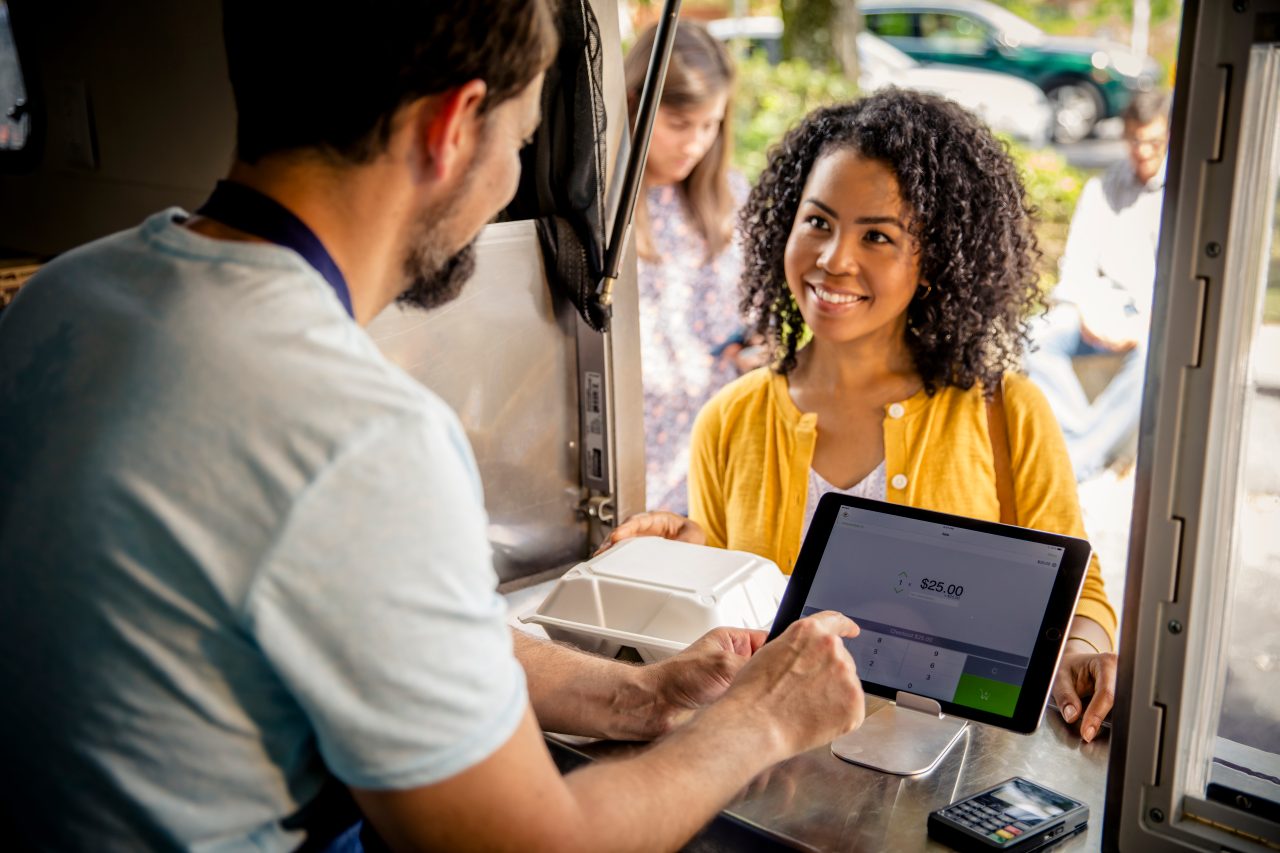 Woman paying with credit card