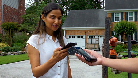 lady paying via mobile phone