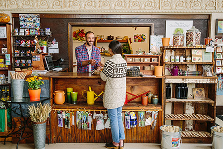 Cashier accepts payment from a customer in retail store